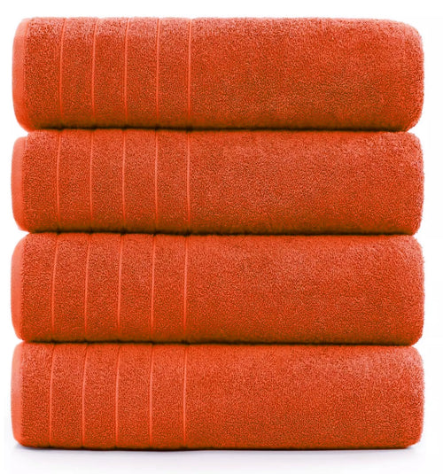 600-GSM bath sheet in seven vibrant colors neatly stacked on a table